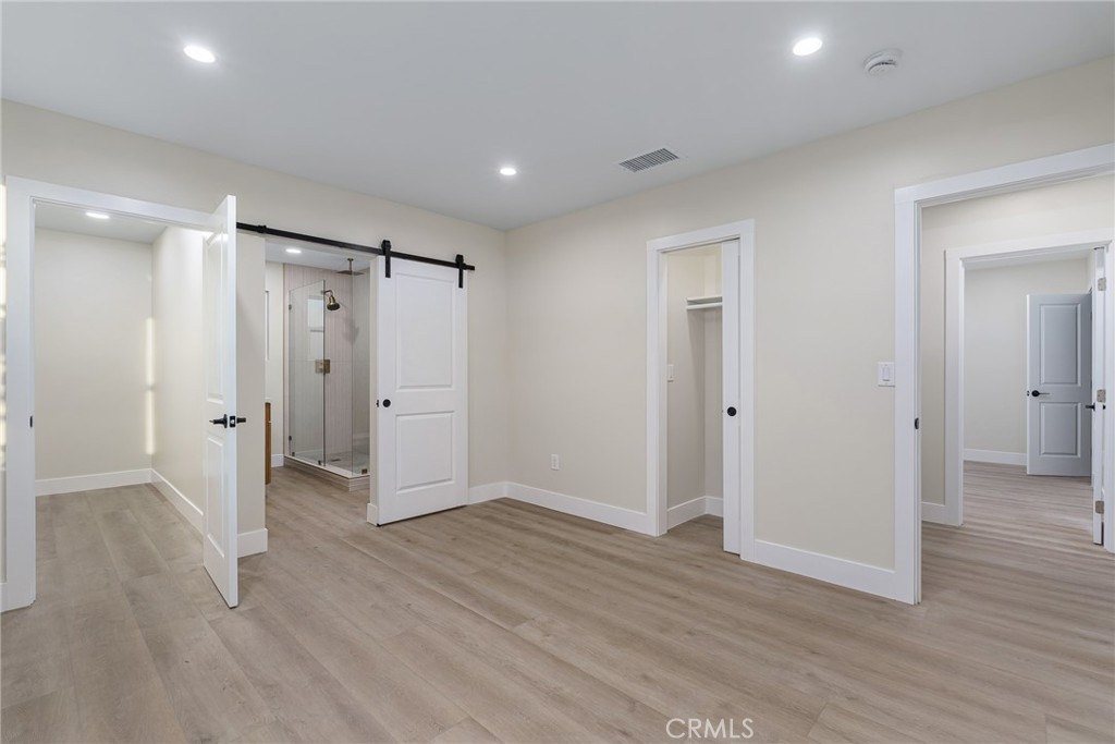 700 West 10th Street Azusa, CA 91702 - Photo 16 of 43 a view of an empty room with wooden floor