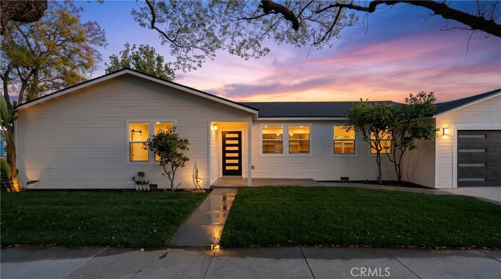 700 West 10th Street Azusa, CA 91702 - Photo 2 of 43 a front view of a house with a garden and yard