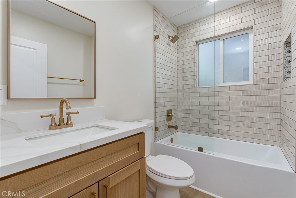 700 West 10th Street Azusa, CA 91702 - Photo 21 of 43 a bathroom with a sink a toilet and bathtub