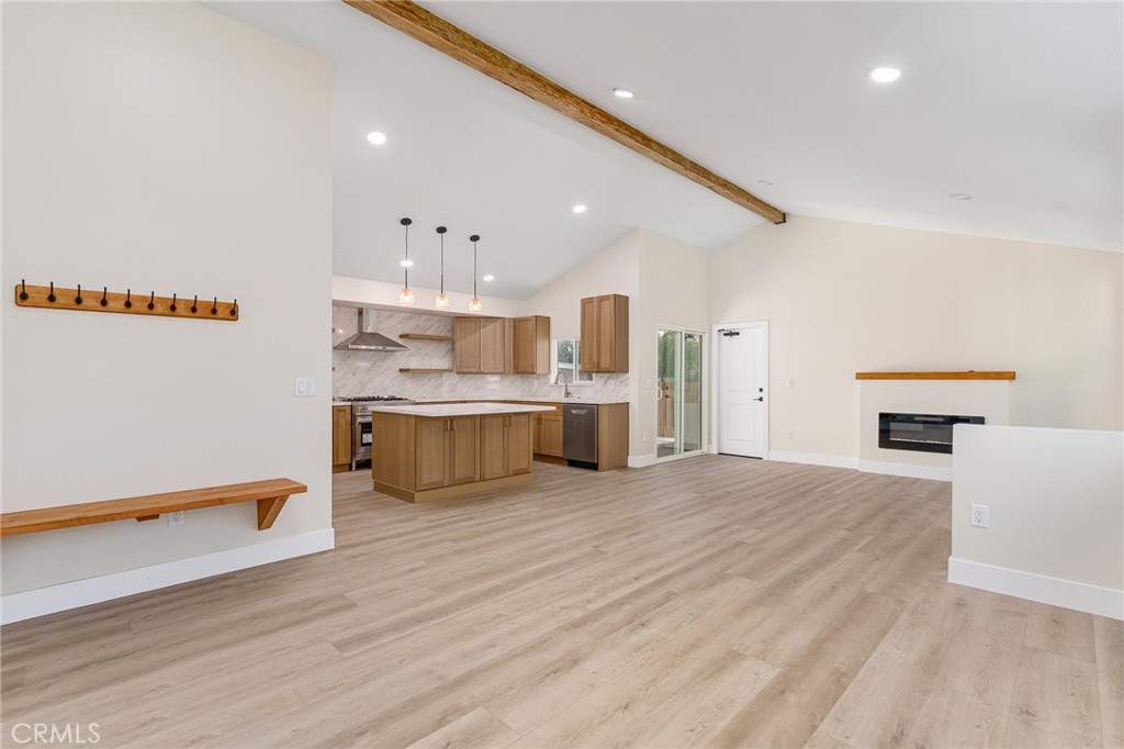 700 West 10th Street Azusa, CA 91702 - Photo 3 of 43 a large kitchen with stainless steel appliances a large counter top a stove and a refrigerator