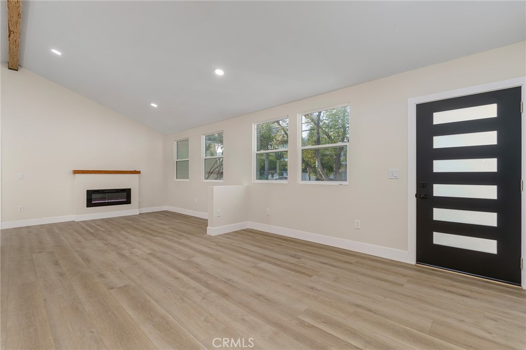 700 West 10th Street Azusa, CA 91702 - Photo 4 of 43 wooden floor in an empty room with a window