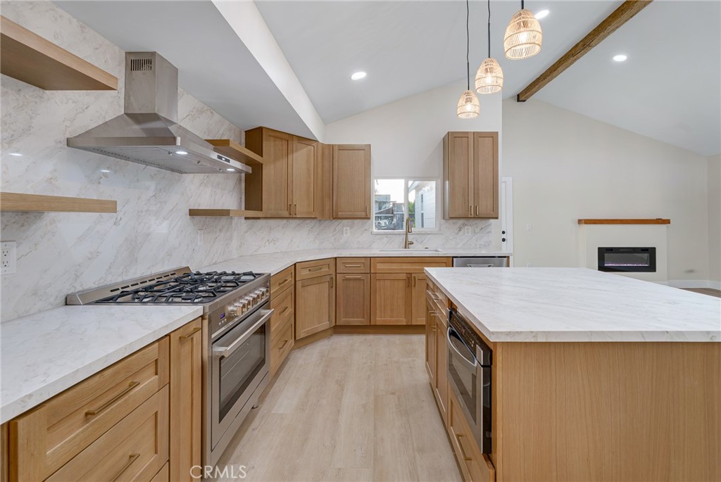700 West 10th Street Azusa, CA 91702 - Photo 10 of 43 a kitchen with stainless steel appliances granite countertop a sink stove and cabinets