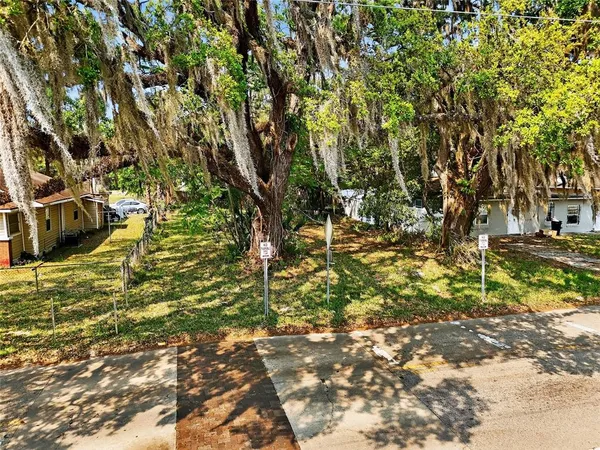 a backyard of a house with lots of green space