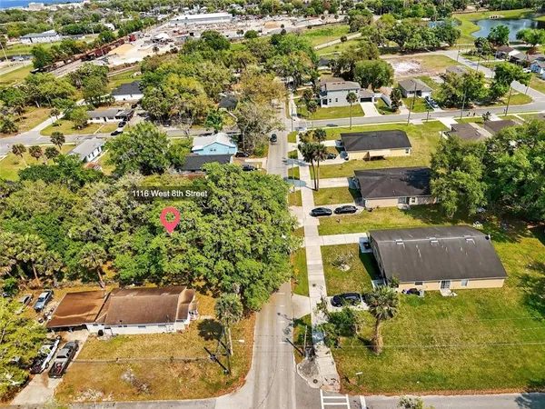 an aerial view of residential houses with outdoor space