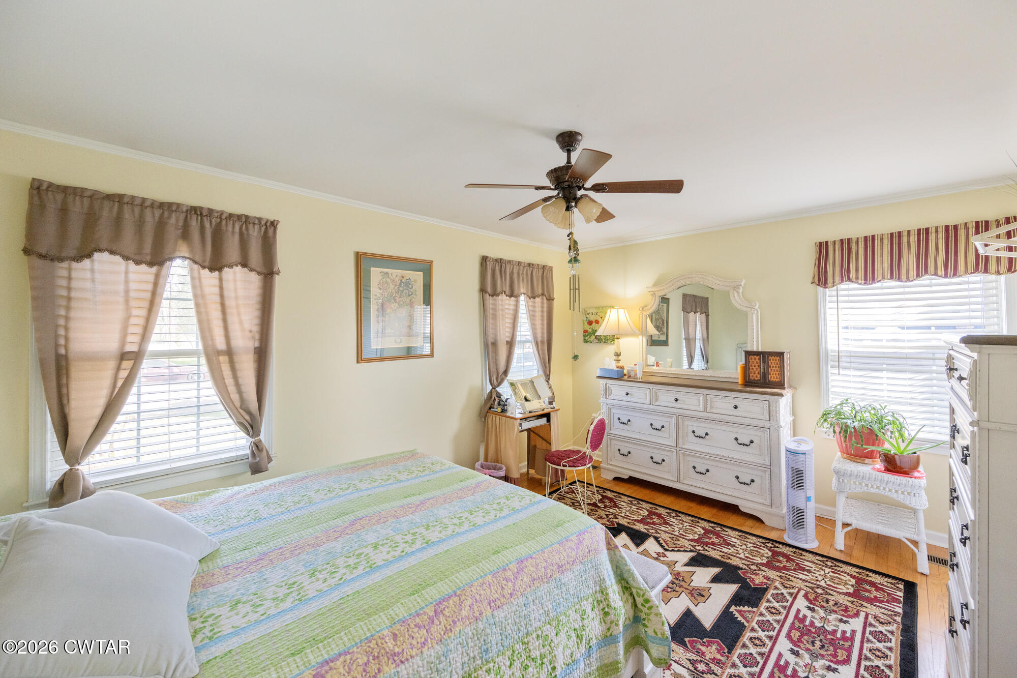 381 Sunset Drive Lexington, TN 38351 - Photo 11 of 26 a bedroom with a bed dresser and a window