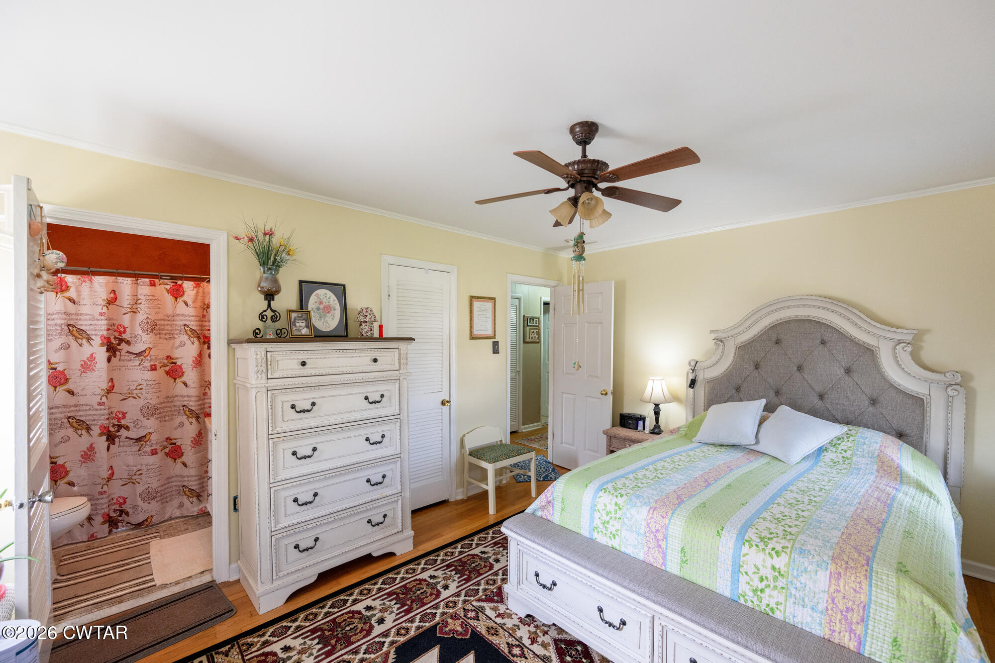 381 Sunset Drive Lexington, TN 38351 - Photo 12 of 26 a bedroom with a bed and a dresser