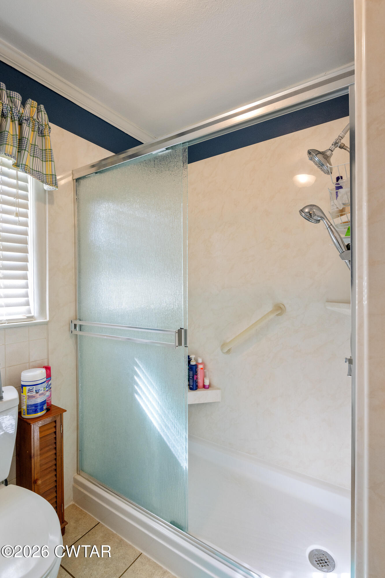 381 Sunset Drive Lexington, TN 38351 - Photo 18 of 26 a bathroom with a shower and a toilet