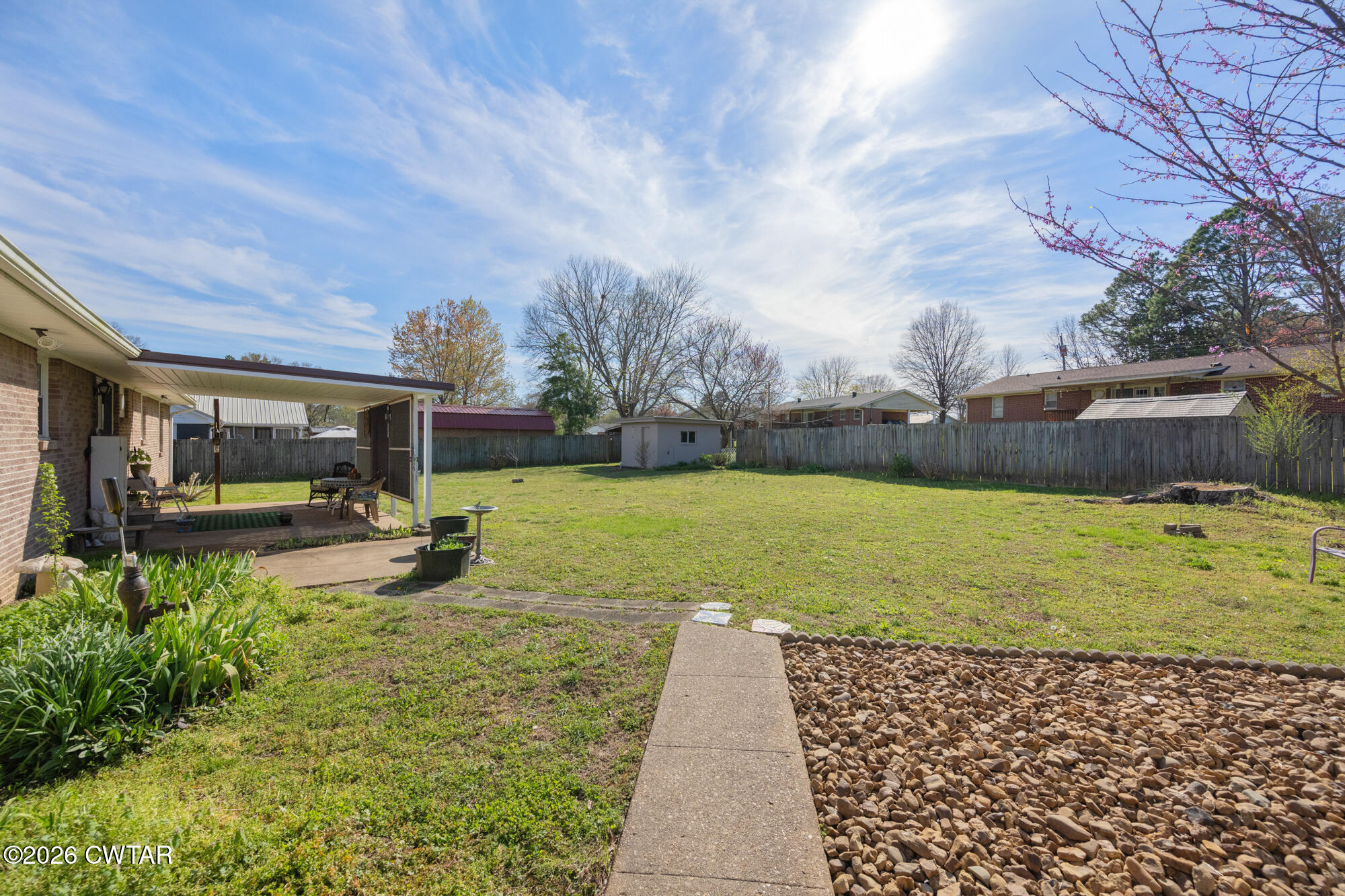 381 Sunset Drive Lexington, TN 38351 - Photo 22 of 26 a view of a house with backyard and sitting area
