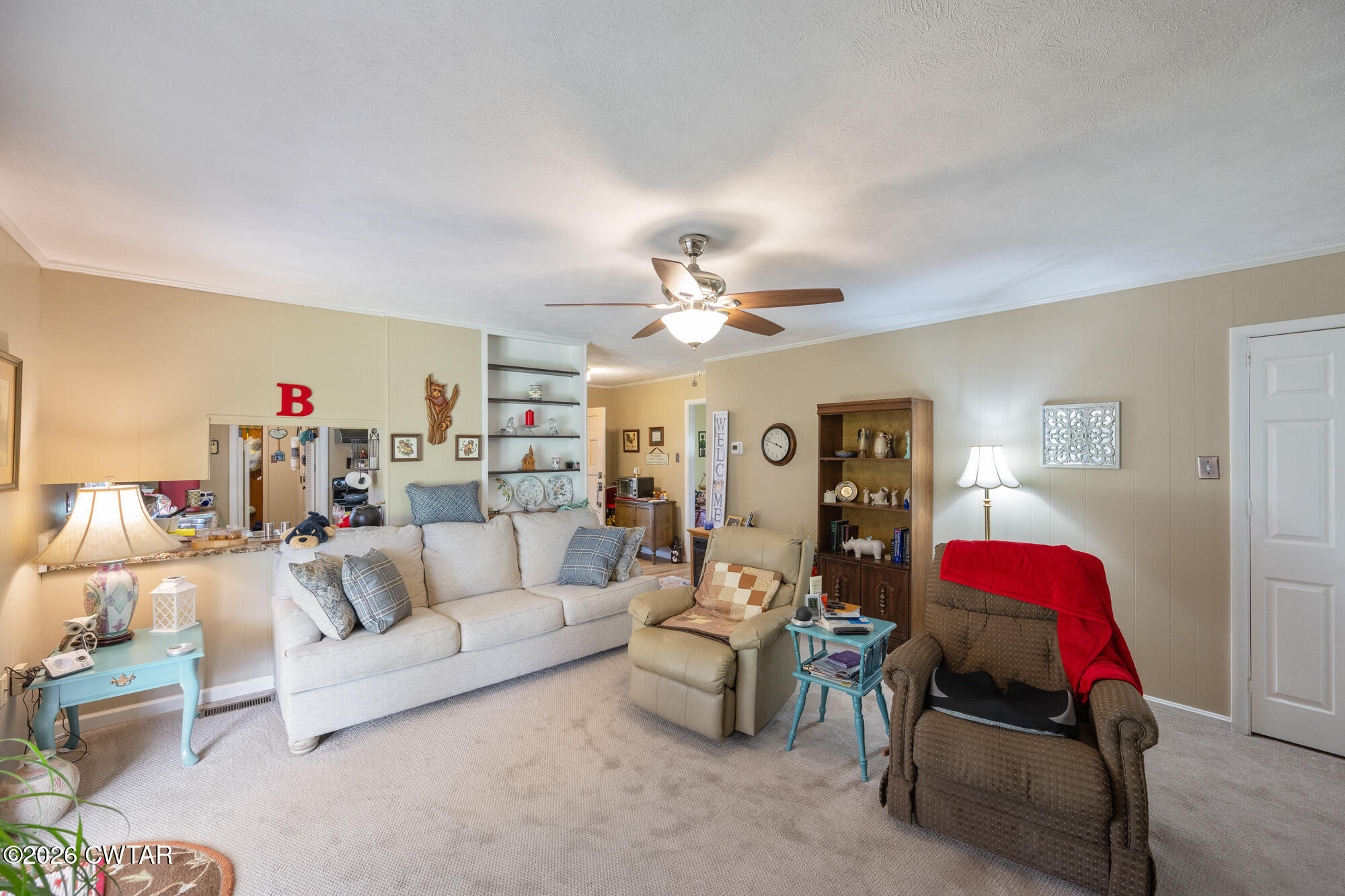 381 Sunset Drive Lexington, TN 38351 - Photo 6 of 26 a living room with furniture and a chandelier