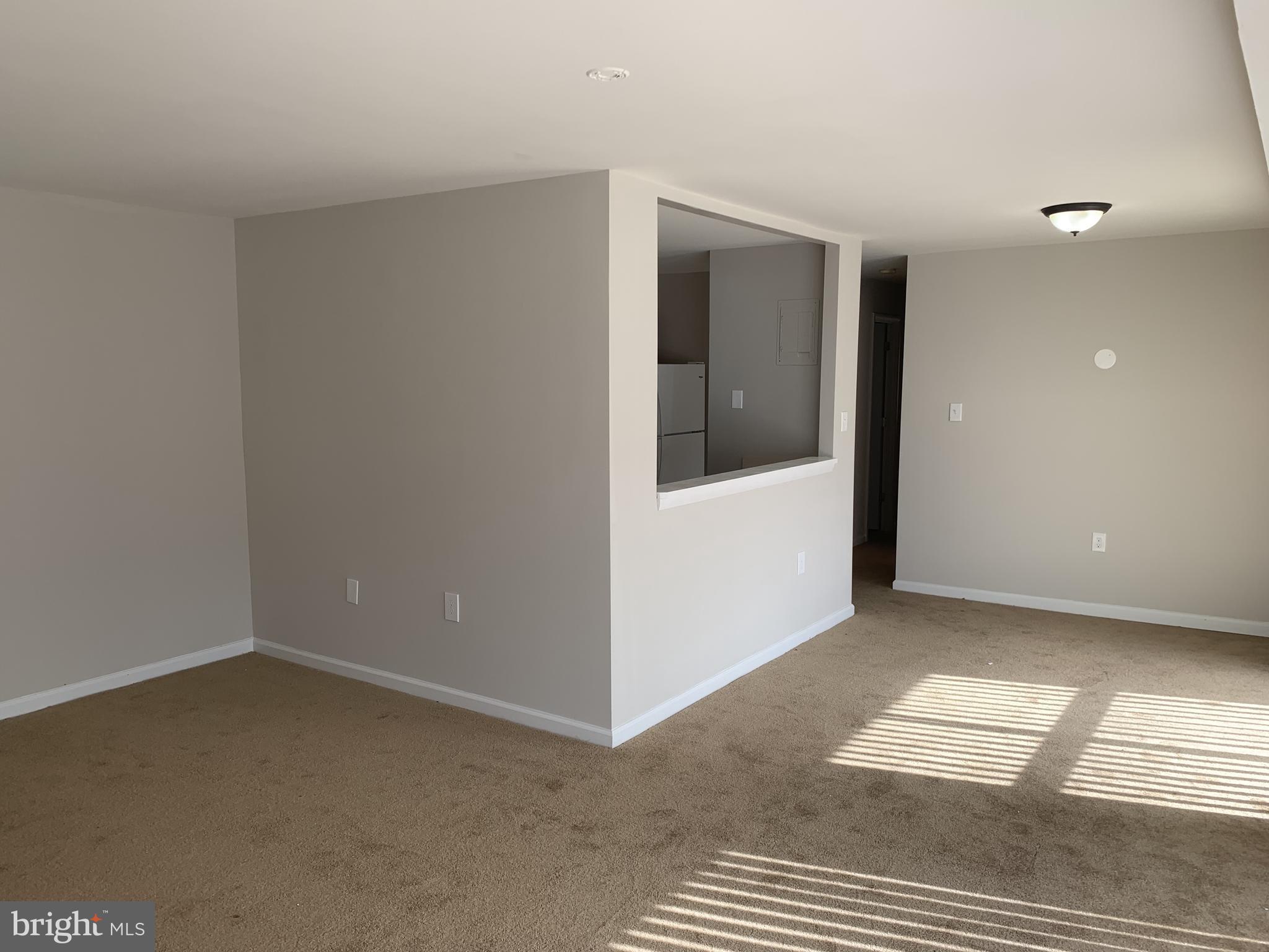 9284 Adelphi Road, Unit 104 Hyattsville, MD 20783 - Photo 3 of 21 Living Room