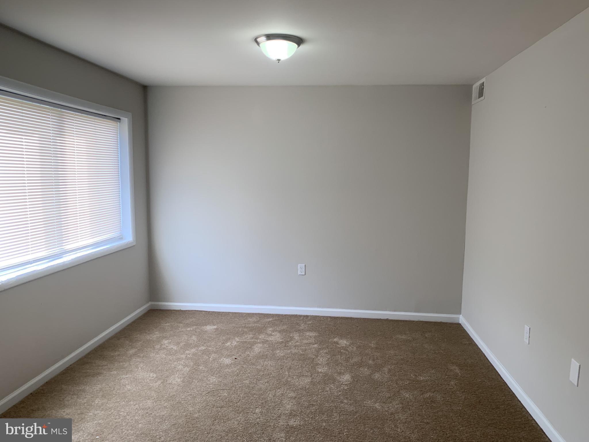 9284 Adelphi Road, Unit 104 Hyattsville, MD 20783 - Photo 10 of 21 Master Bedroom