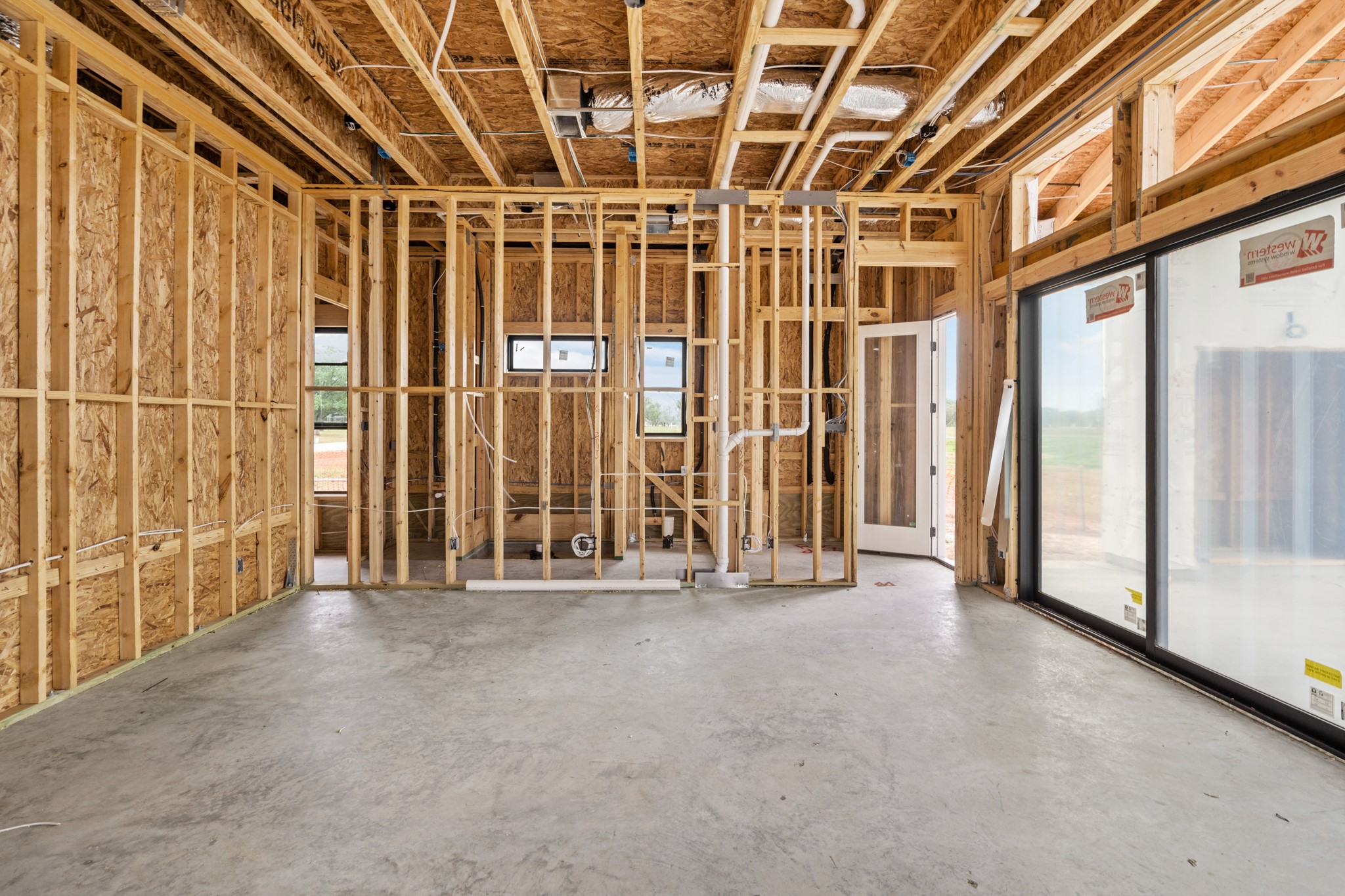 35623 Kinabalu Way Wallis, TX 77485 - Photo 3 of 25 a view of an empty room with a sliding door