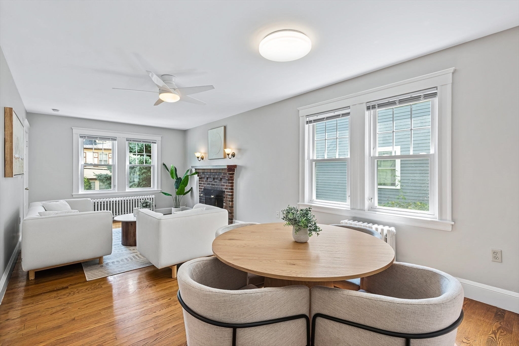 57 Huron Circle Boston, MA 02124 - Photo 11 of 32 a dining room with furniture a window and wooden floor