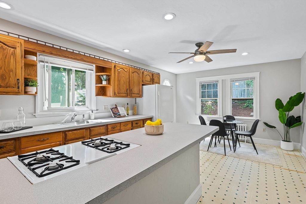 57 Huron Circle Boston, MA 02124 - Photo 13 of 32 a kitchen with a dining table and chairs