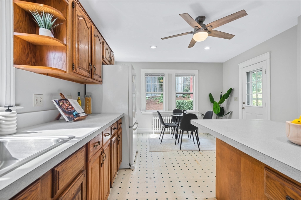 57 Huron Circle Boston, MA 02124 - Photo 17 of 32 a kitchen with a table and chairs