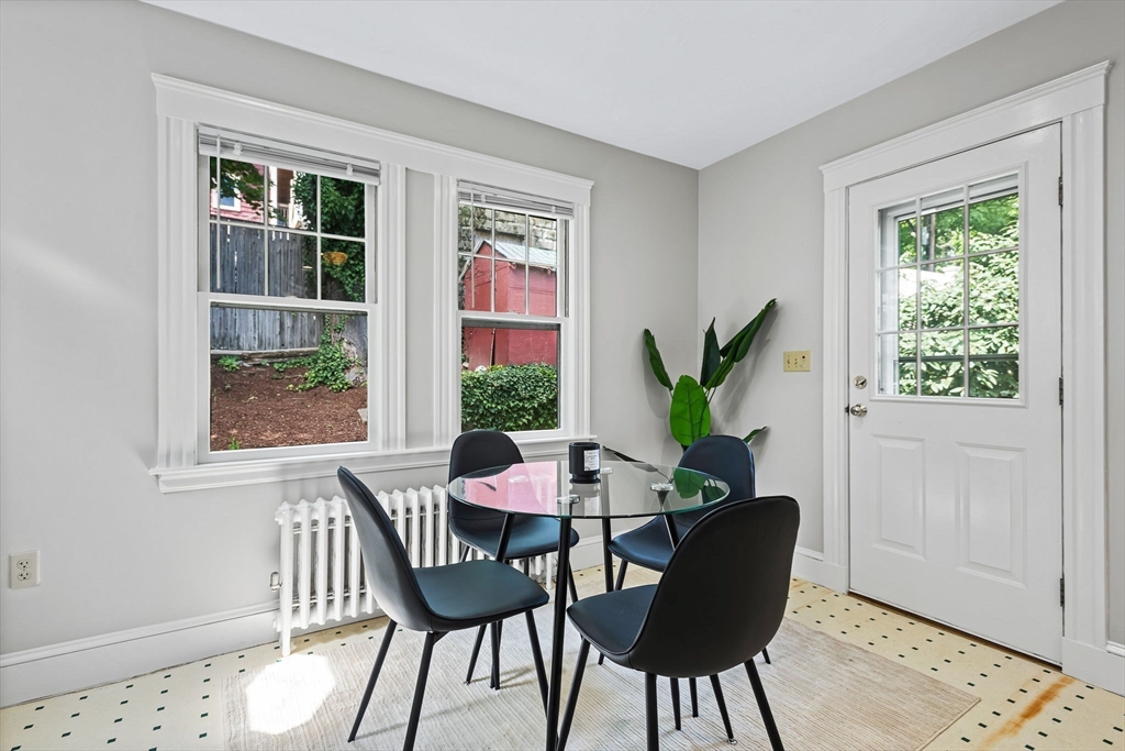 57 Huron Circle Boston, MA 02124 - Photo 18 of 32 a view of a dining room with furniture window and wooden floor