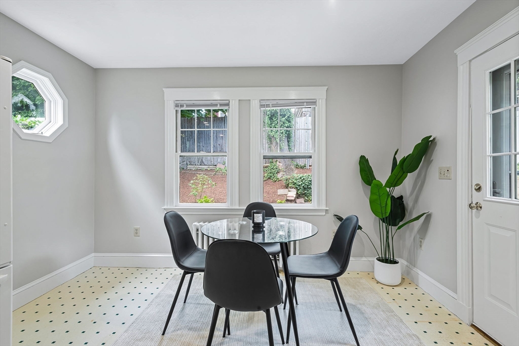 57 Huron Circle Boston, MA 02124 - Photo 19 of 32 a view of a dining room with furniture window and wooden floor