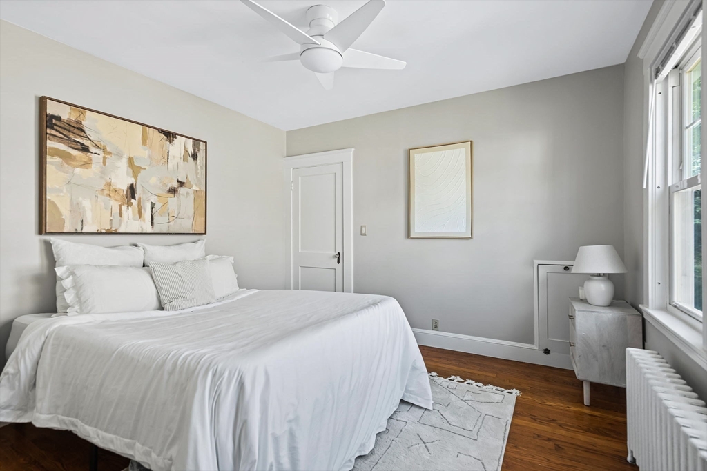 57 Huron Circle Boston, MA 02124 - Photo 24 of 32 a bedroom with a bed and a painting on the wall