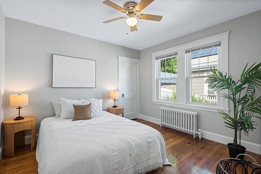 57 Huron Circle Boston, MA 02124 - Photo 26 of 32 a bedroom with a large bed and a window