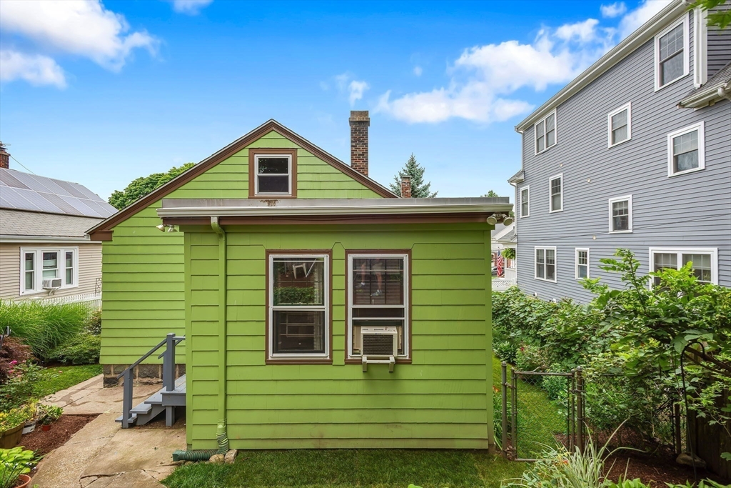 57 Huron Circle Boston, MA 02124 - Photo 28 of 32 a front view of a house with a garden