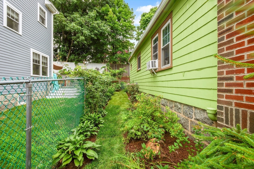 57 Huron Circle Boston, MA 02124 - Photo 31 of 32 a view of a backyard with plants