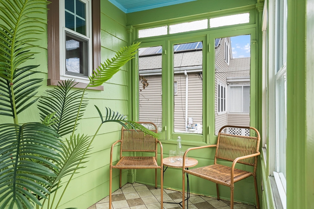 57 Huron Circle Boston, MA 02124 - Photo 4 of 32 a living room filled with furniture and a potted plant