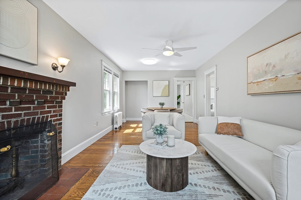 57 Huron Circle Boston, MA 02124 - Photo 6 of 32 a living room with furniture and a fireplace