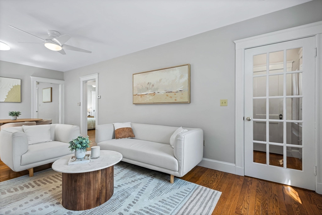 57 Huron Circle Boston, MA 02124 - Photo 7 of 32 a living room with furniture and a wooden floor