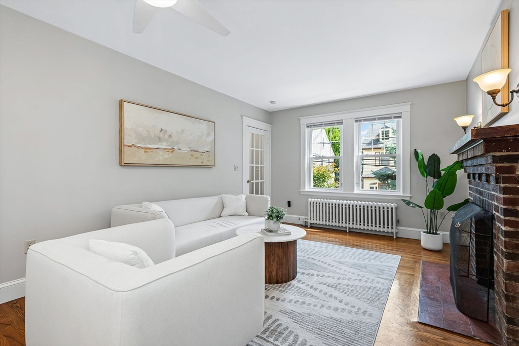 57 Huron Circle Boston, MA 02124 - Photo 9 of 32 a living room with furniture a window and a flat screen tv