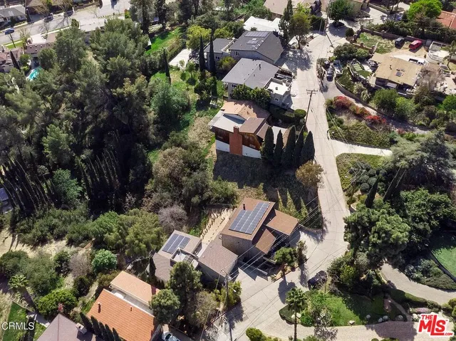 an aerial view of a house with outdoor space