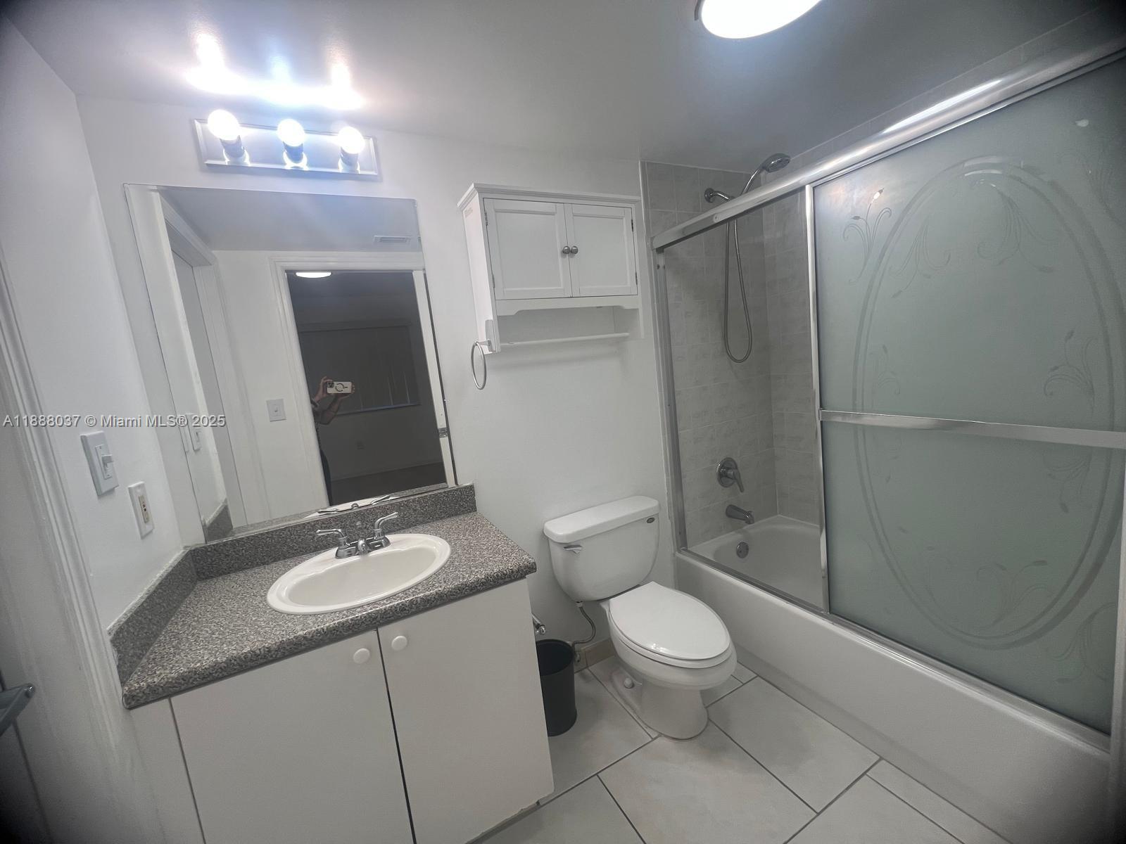 8900 Collins Avenue, Unit 203 Surfside, FL 33154 - Photo 7 of 11 a bathroom with a sink a toilet and shower