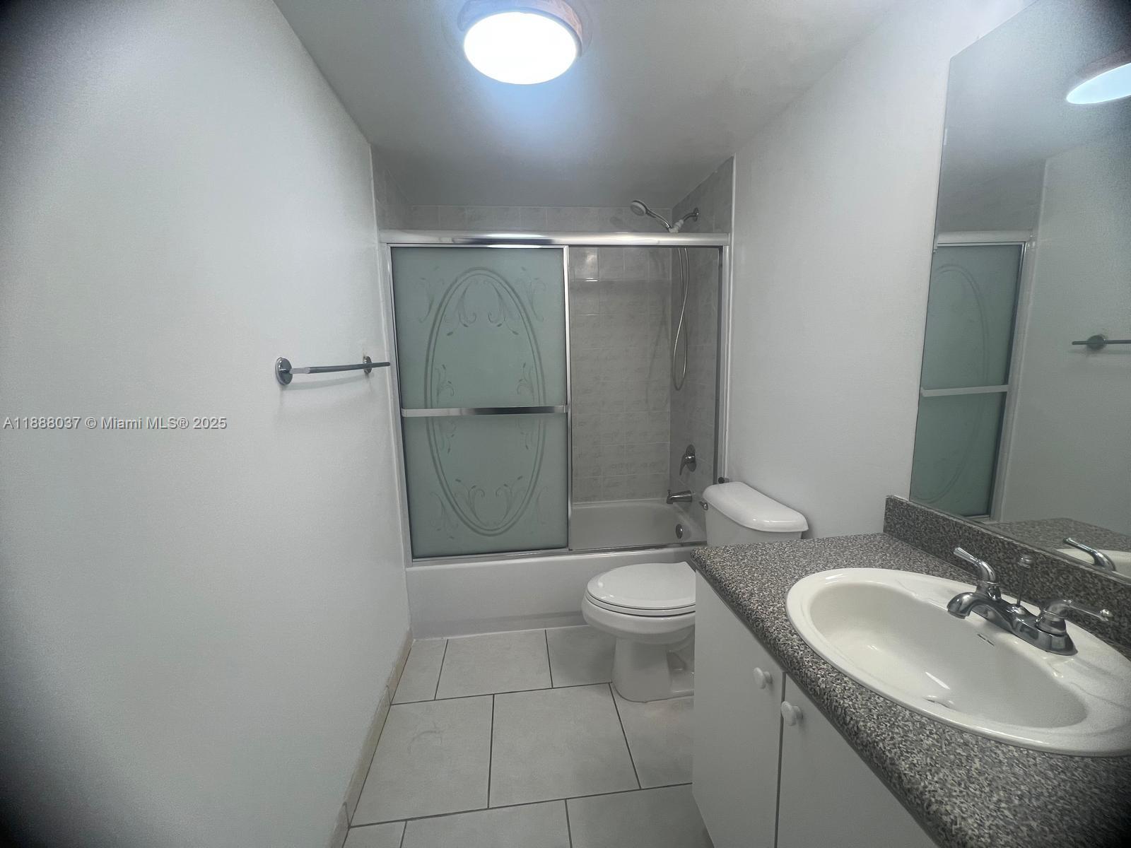 8900 Collins Avenue, Unit 203 Surfside, FL 33154 - Photo 10 of 11 a bathroom with a sink toilet and shower