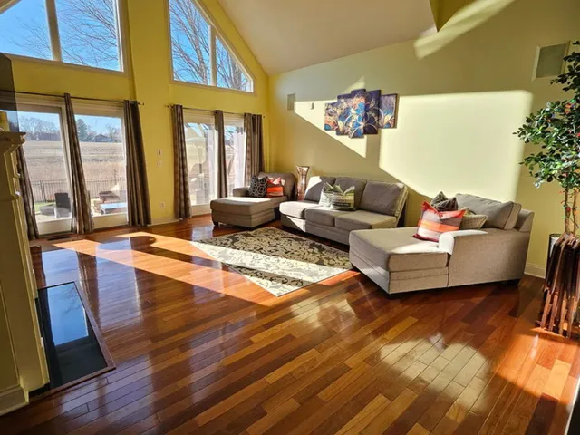 a kitchen with kitchen island granite countertop a stove a sink and a microwave