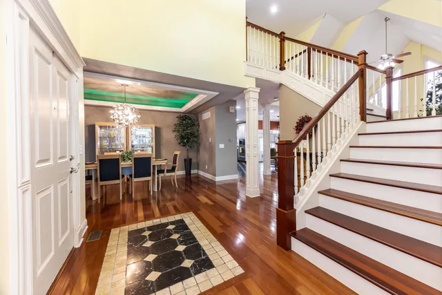 a kitchen with stainless steel appliances granite countertop a stove and white cabinets