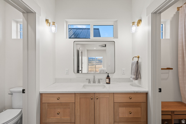 2920 West Temple Cyn Road Laketown, UT 84038 - Photo 55 of 69 Full bathroom with open vanity area. Doors close off to shower and water closet so multiple people can get ready at once.