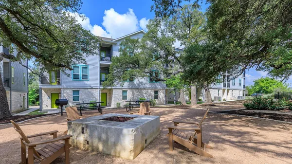 a view of a patio with chairs and tables