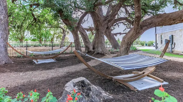 a view of a backyard with sitting area