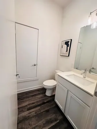 a bathroom with a sink toilet and vanity