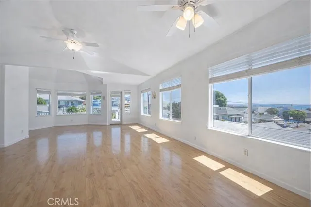 a living room with furniture fireplace and wooden floor