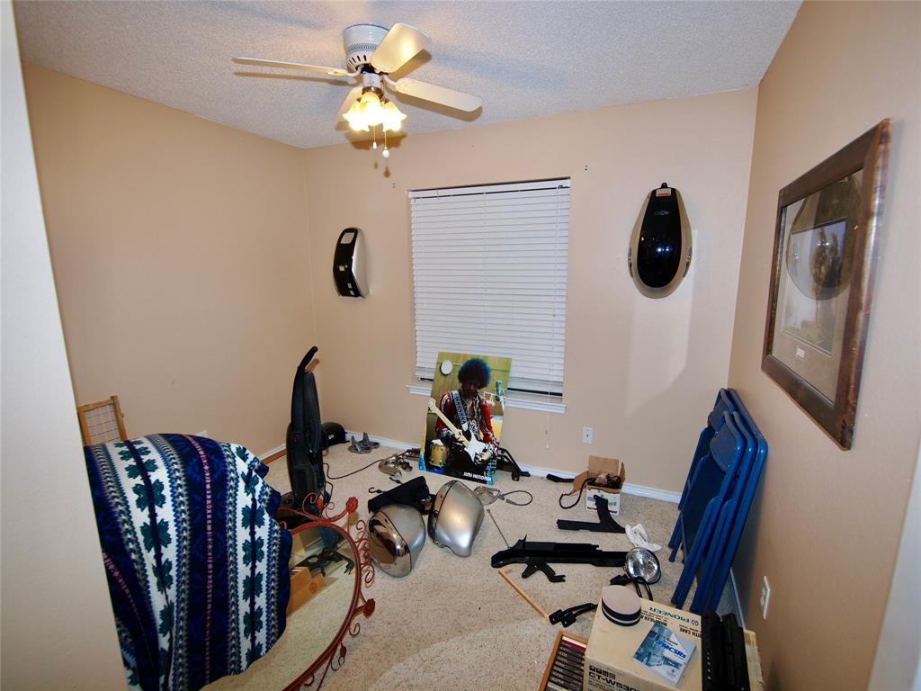3106 South Lipsey Street Decatur, TX 76234 - Photo 15 of 27 a view of a workspace with furniture and a mirror