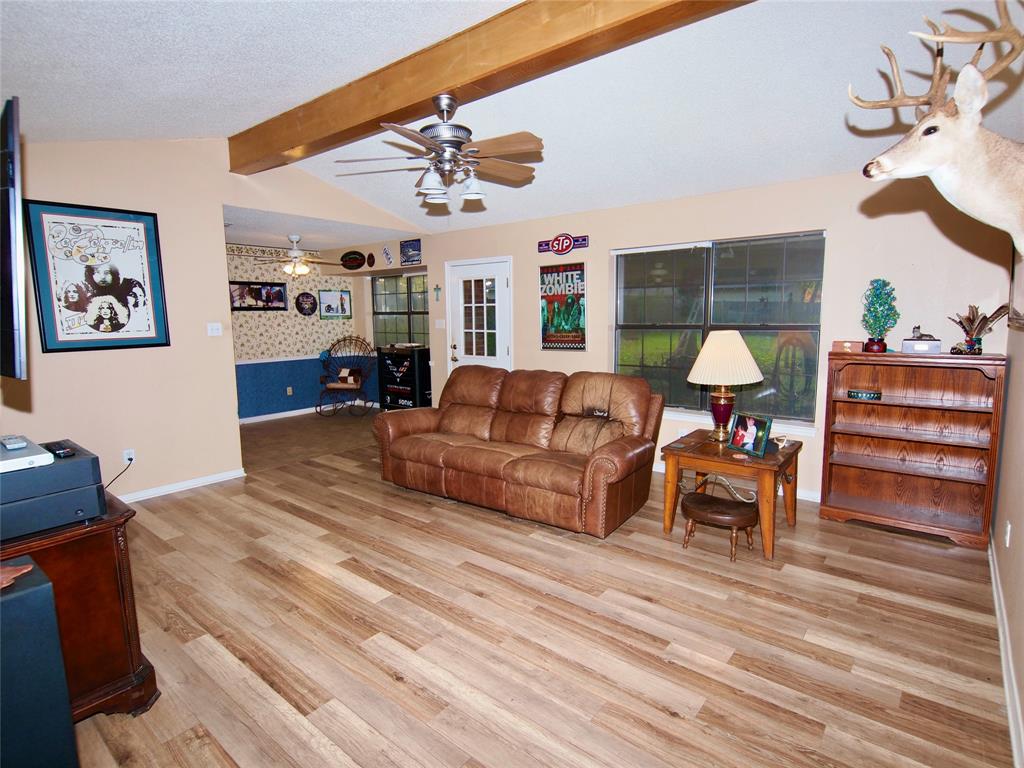 3106 South Lipsey Street Decatur, TX 76234 - Photo 2 of 27 a living room with furniture and a large window
