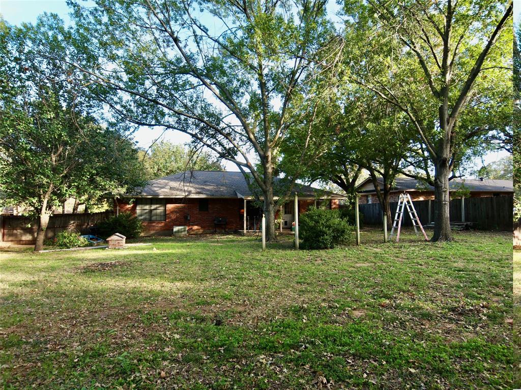 3106 South Lipsey Street Decatur, TX 76234 - Photo 22 of 27 a big yard with trees and plants