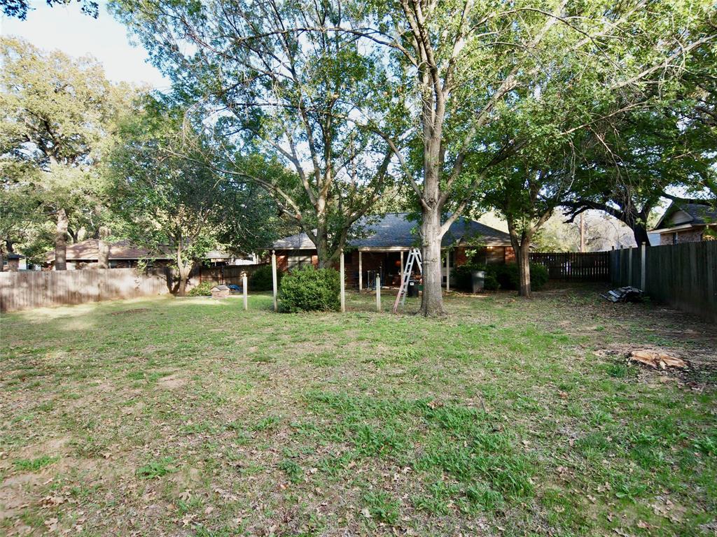3106 South Lipsey Street Decatur, TX 76234 - Photo 24 of 27 a view of a house with a yard