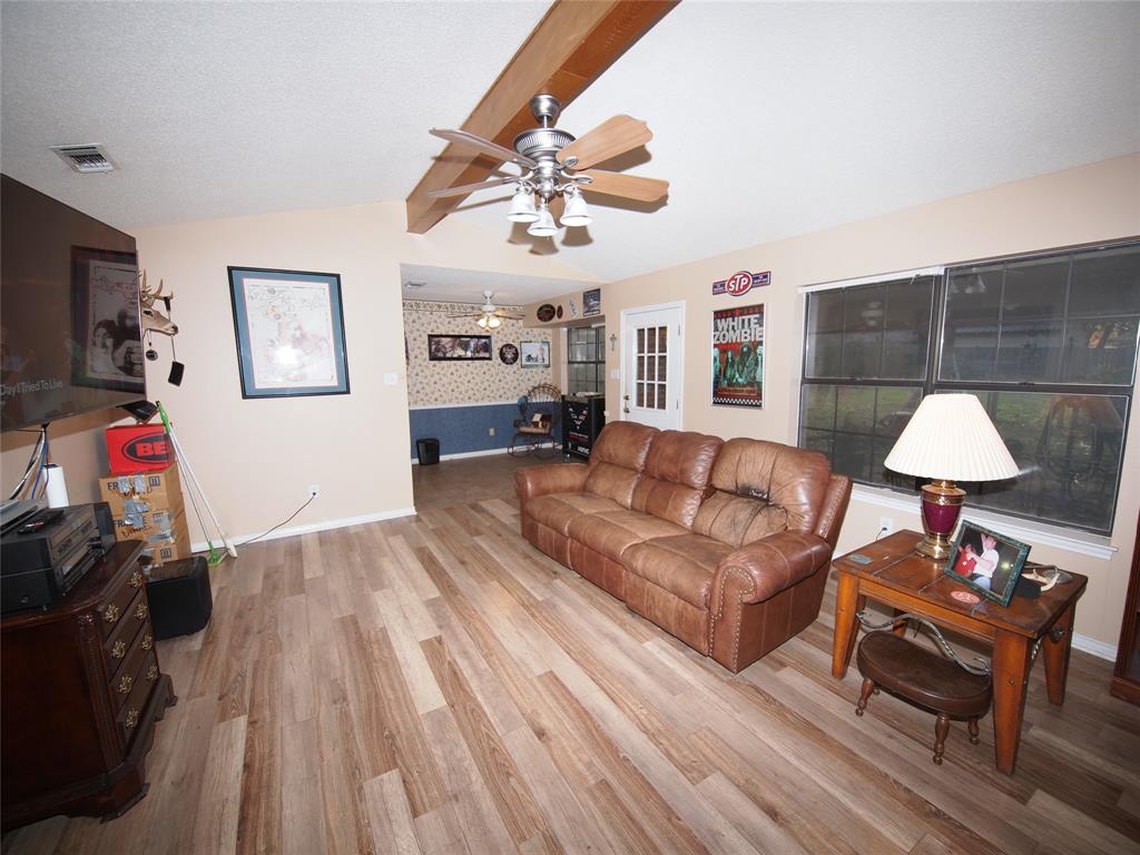 3106 South Lipsey Street Decatur, TX 76234 - Photo 5 of 27 a living room with furniture and wooden floor
