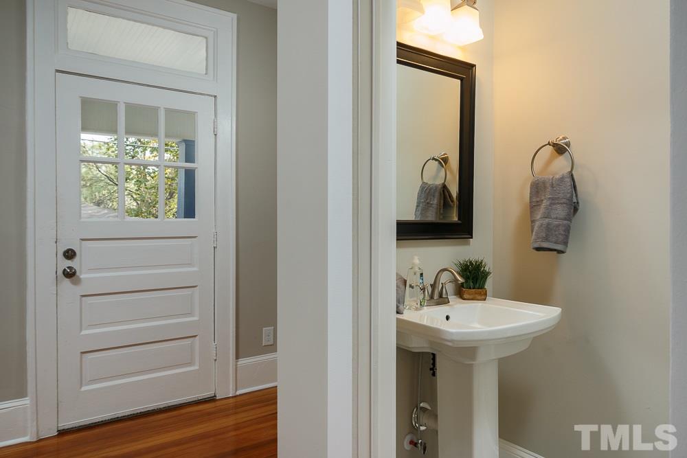 605 North East Street Raleigh, NC 27604 - Photo 11 of 25 a bathroom with a sink and a mirror
