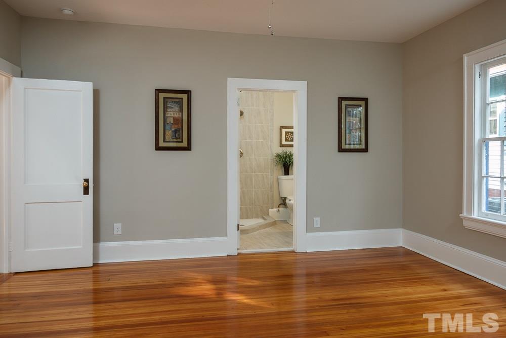 605 North East Street Raleigh, NC 27604 - Photo 12 of 25 a view of an empty room with window and wooden floor