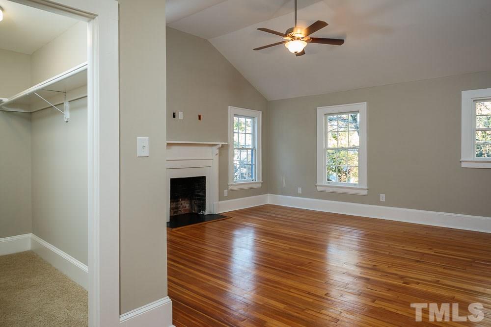 605 North East Street Raleigh, NC 27604 - Photo 14 of 25 a view of empty room with fireplace and wooden floor