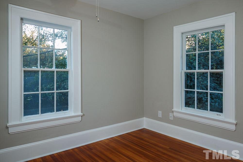 605 North East Street Raleigh, NC 27604 - Photo 20 of 25 an empty room with wooden floor and windows