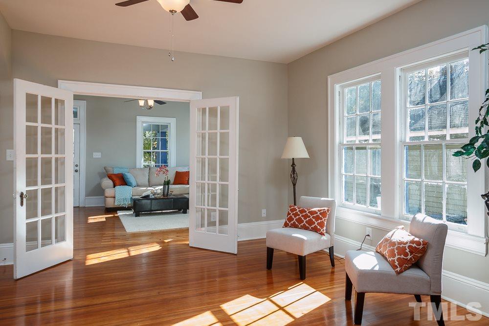 605 North East Street Raleigh, NC 27604 - Photo 4 of 25 a living room with furniture and a large window
