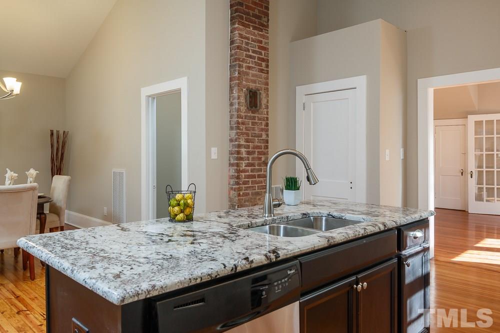 605 North East Street Raleigh, NC 27604 - Photo 9 of 25 a kitchen with a sink and a wooden floor